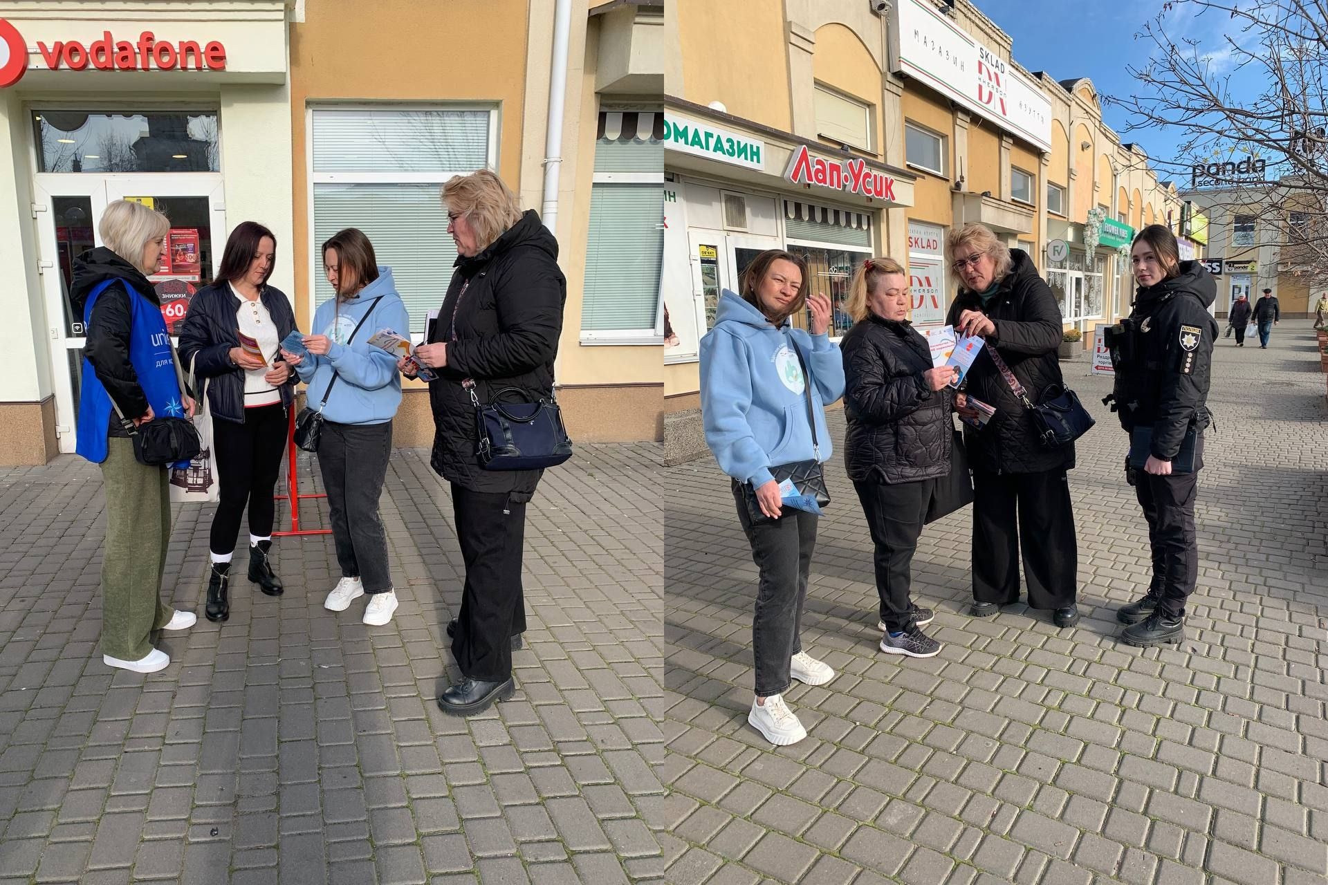 Група жінок-волонтерів та поліцейська стоять на тротуарі біля магазинів, роздаючи перехожим інформаційні листівки. Одна з жінок має сумку з логотипом UNICEF.